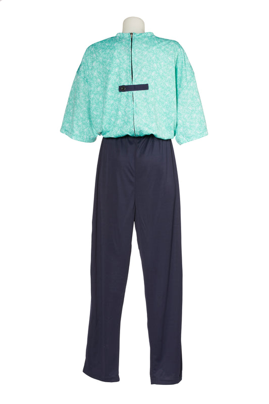 Women's one-piece sundowner 'dementia' suit for daytime wear, viewed from the back - light green top with navy bottoms