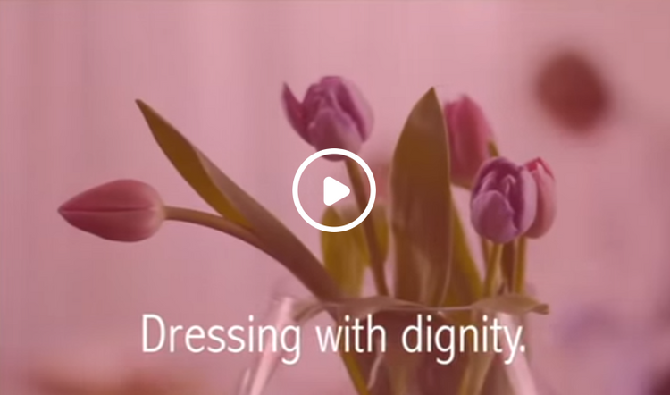 Video of a carer and patient, showing how to dress someone easily using petal back clothing 