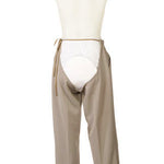 Men's adaptive trousers in beige, viewed from the back with the open adaptive design