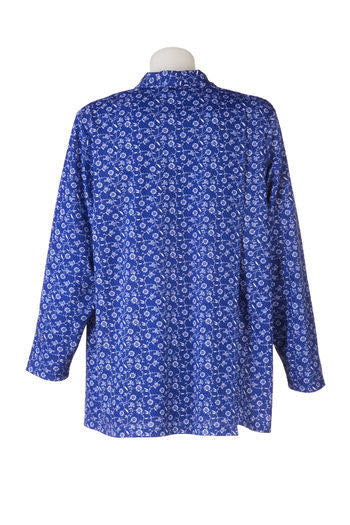 Rear view of the petal back split closure on the women's long sleeve adaptive blouse. Fabric is blue and white floral pattern